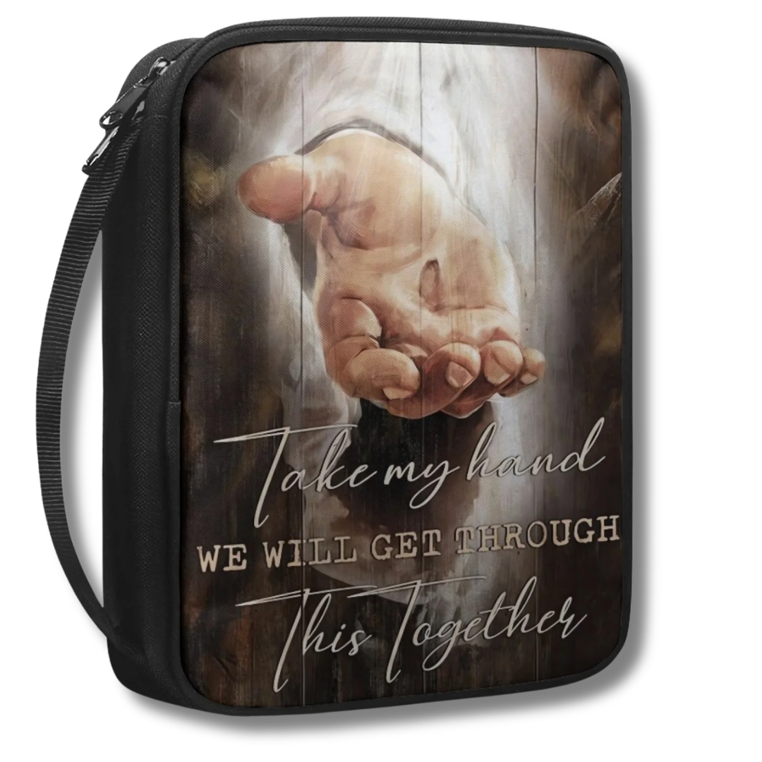 Scenic Scripture Bible Carry Bag beside an open Bible, showing scenic faith artwork and a top handle