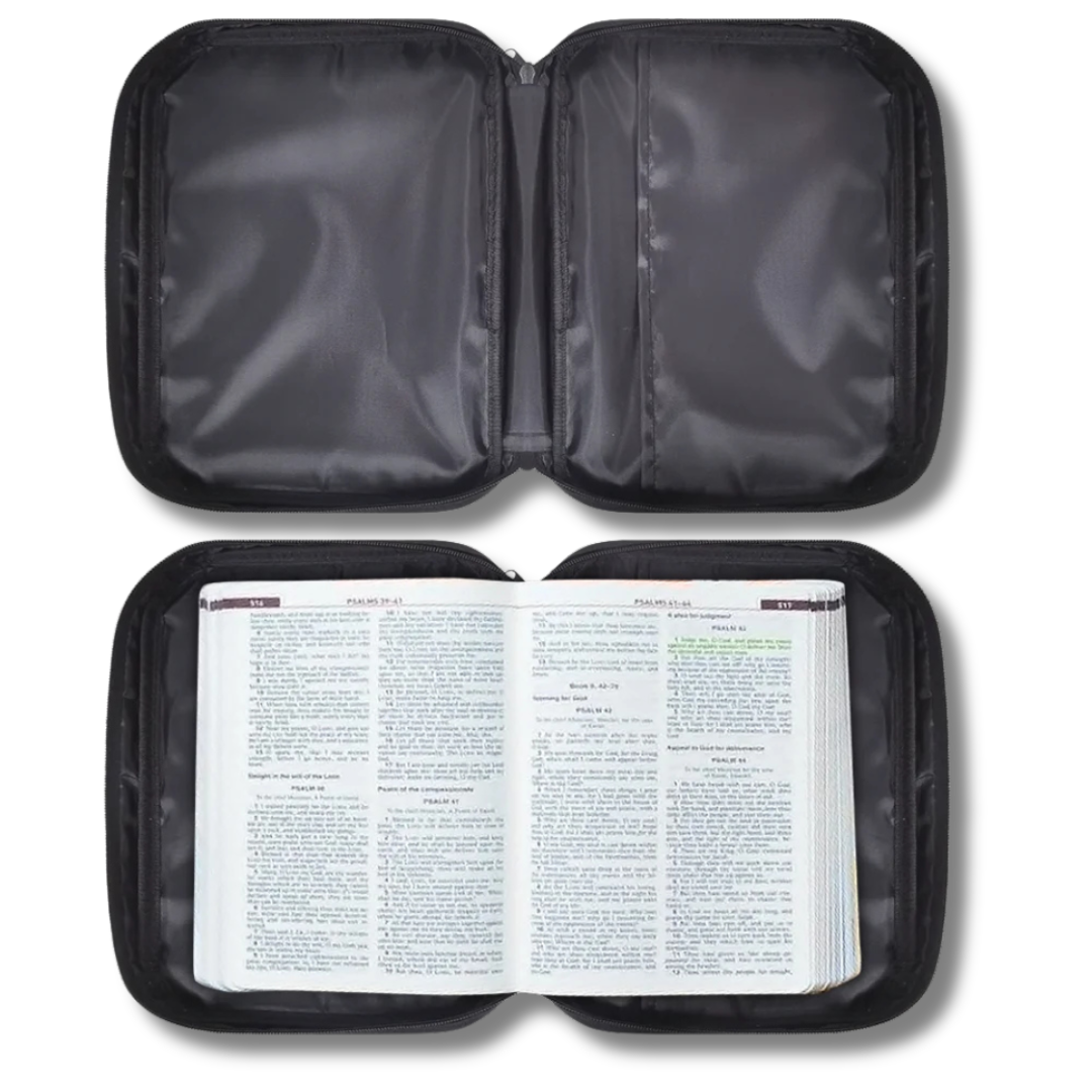 Scenic Scripture Bible Carry Bag beside an open Bible, showing scenic faith artwork and a top handle