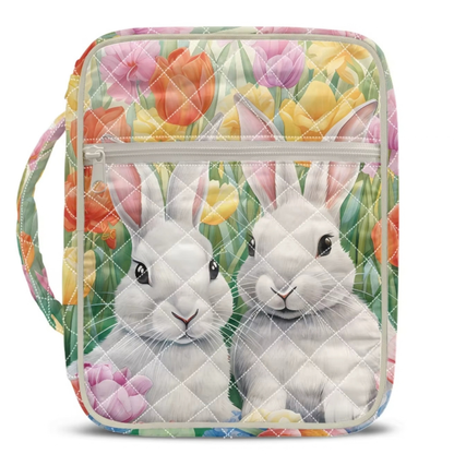 White quilted Bible case with bunnies among colorful tulips.