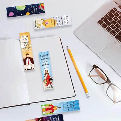 Christian bookmarks beside an open notebook, pencil, glasses, and laptop

