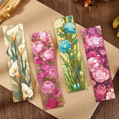 Four floral paper bookmarks displayed on a kraft-paper background
